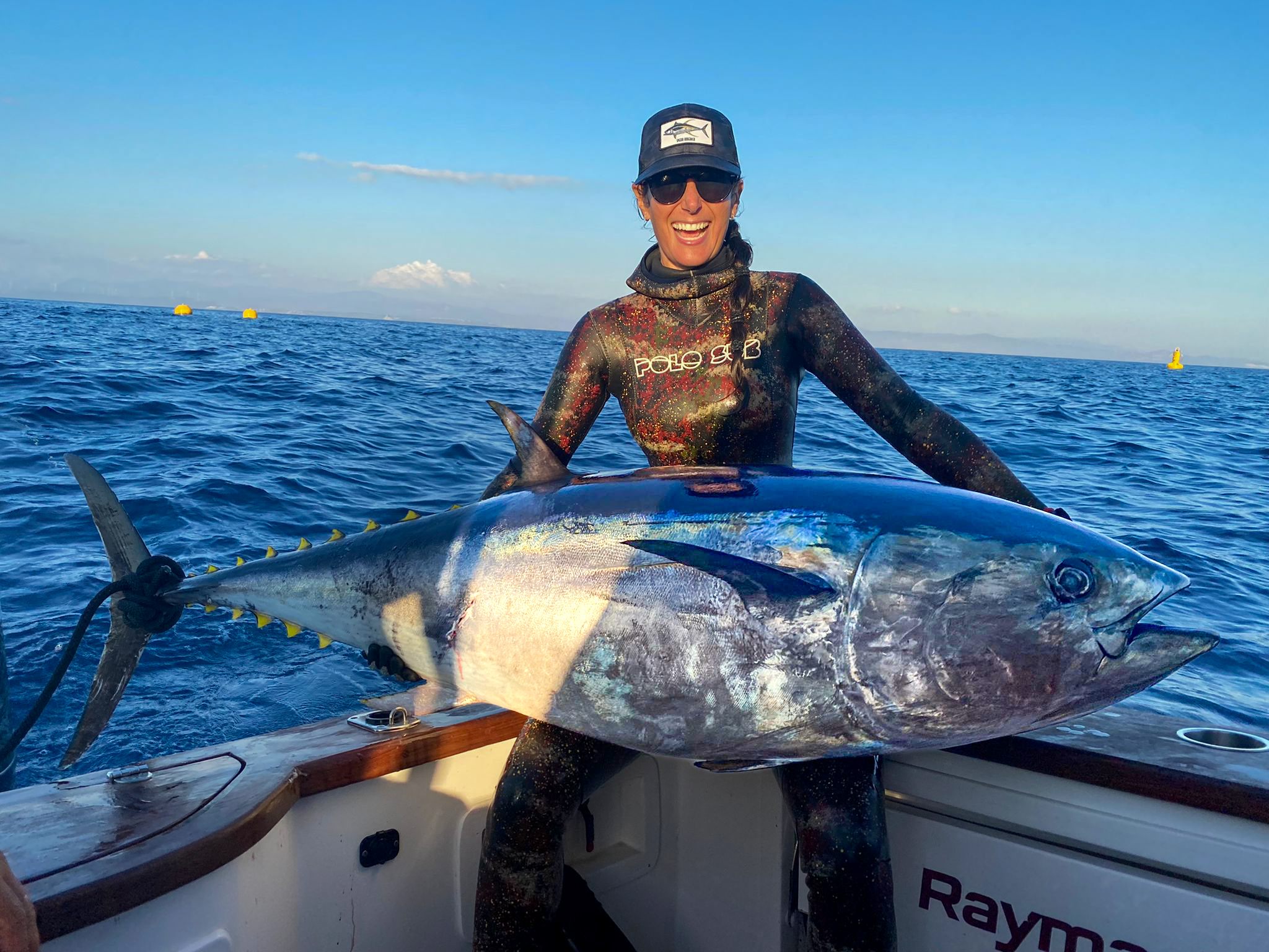 Lauren Sarasua holding a bluefin tuna on the boat in Turkey