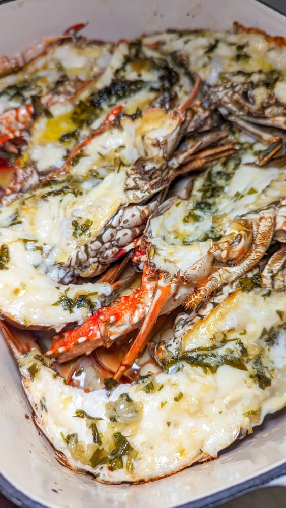 Baked lobster halves with butter, garlic and herbs