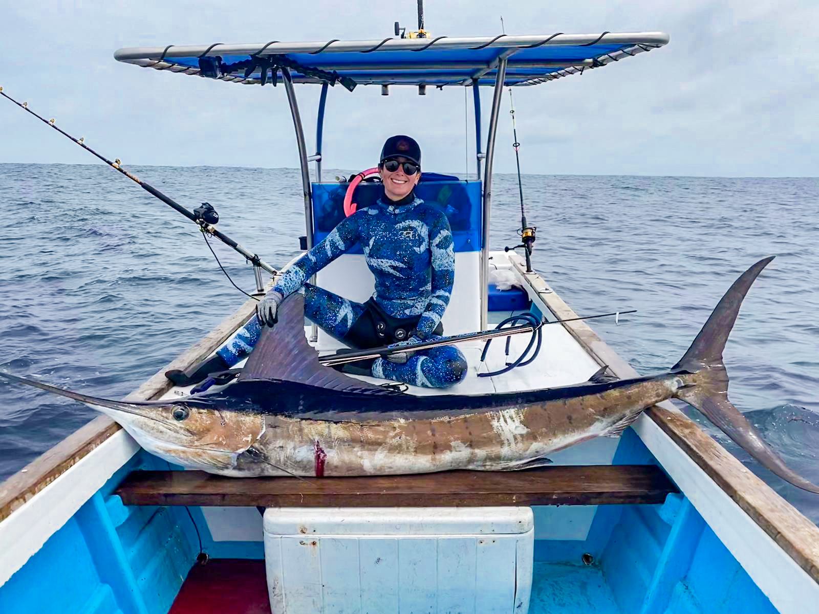 Lauren Sarasua in the boat with a marlin in Ecuador